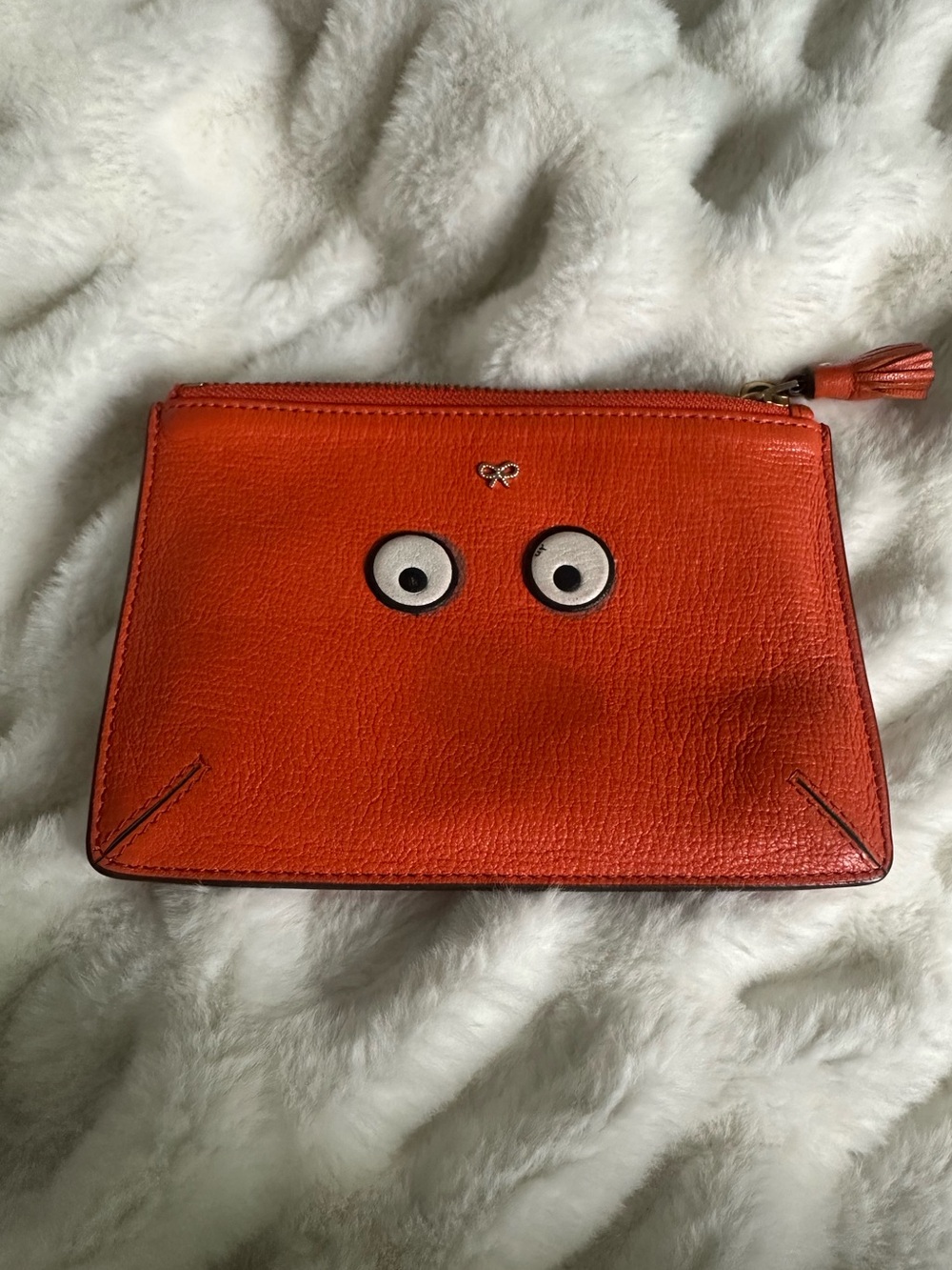 Anya Hindmarch Eyes Orange Capra Leather Zip Pouch Tassel Clutch Bag.